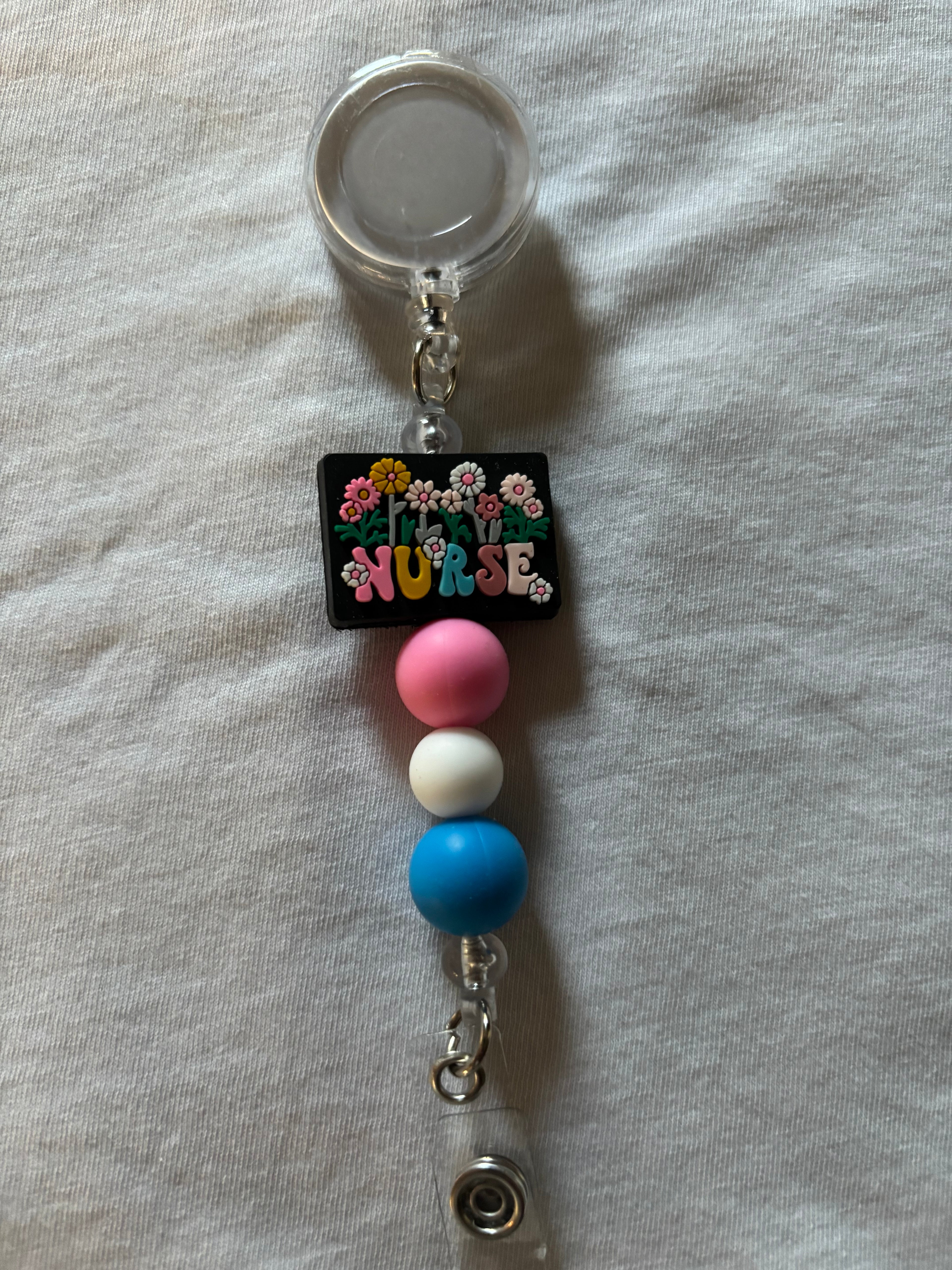 Nurse with Flowers Badge Reel